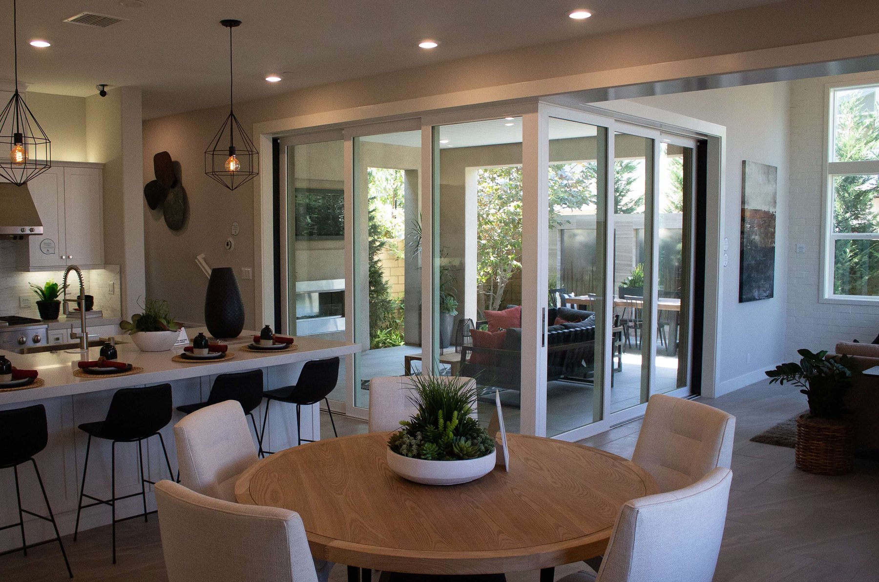 Open kitchen and dining layout with large patio doors
